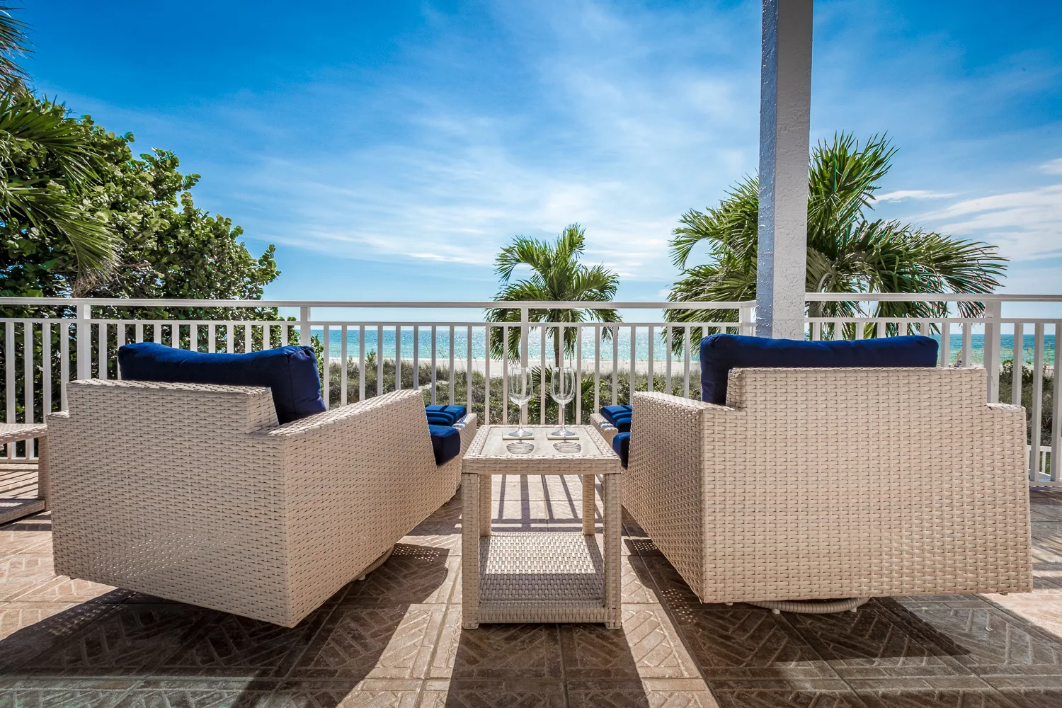 Waterfront deck with lounge seating overlooking the Gulf of Mexico