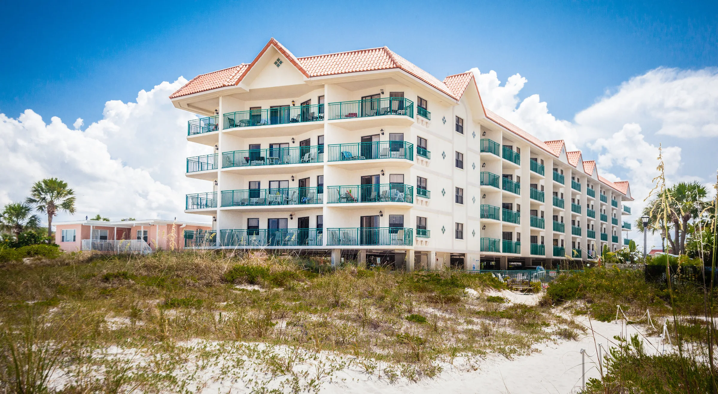 Beachfront condominium building photographed from the sand
